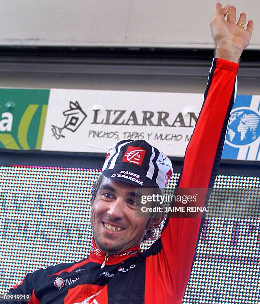 Spain's David Arroyo of Caisse D'Epargne celebrates on the podium after winning the seventeenth stage of the Tour of Spain on September 19 between...
