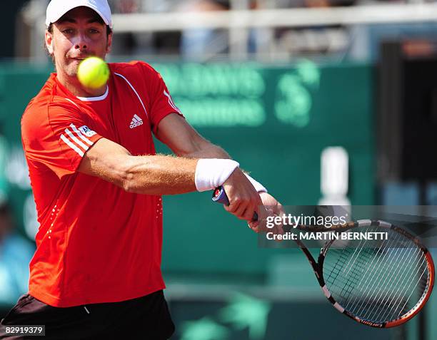 Chilean Nicolas Massu hits a return against Australian Chris Guccione during their Davis Cup 2008 World Group play-offs on September 19, 2008 in...