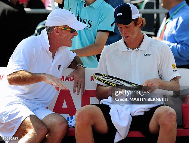 Australia' s tennis team captain John Fitzgerald gives instructions to player Chris Guccione during the Davis Cup 2008 World Group match against...