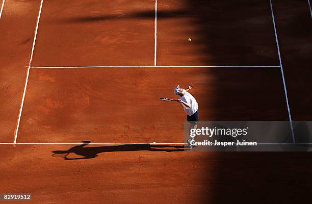 Andy Roddick of the United States serves the ball to David Ferrer during day one of the semi final Davis Cup between Spain and the United States at...