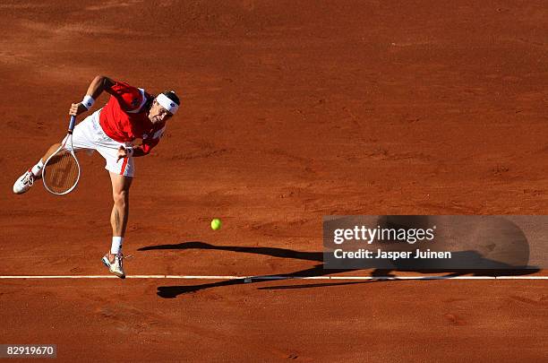 David Ferrer of Spain serves the ball to Andy Roddick of the United States during day one of the semi final Davis Cup match between Spain and the...