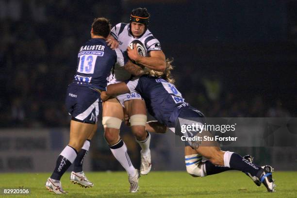 Bristol number 8 Dan Ward-Smith is tackled by Luke Mcalister and Sebastien Chabal of Sale during the Guinness Premiership match between Bristol Rugby...