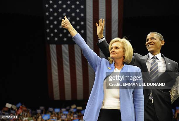 Democratic presidential candidate Illinois Senator Barack Obama waves with Senator Claire McCaskill during a "Women's Rally For The Change We Need"...
