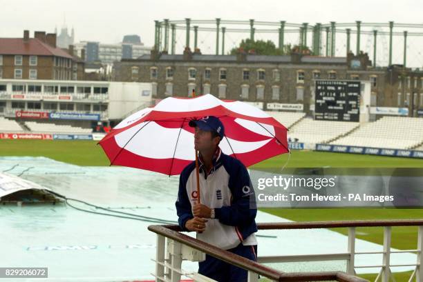 England's Michael Vaughan waits for the rain to stop before the fifth day of the fourth and final nPower Test Match at the Oval, London.