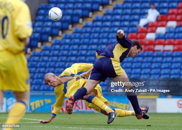 Coventry's Jay Bothroyd gets tangled with Wimbledon's Mark Williams, during their Nationwide Division One match at Wimbledon's Selhurst Park ground...