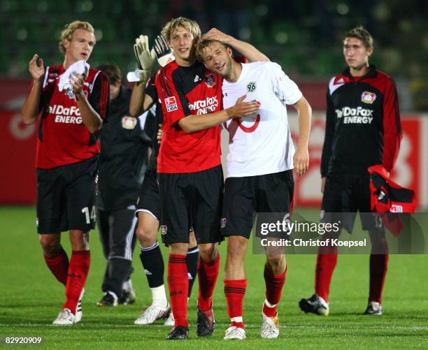 Sascha Dum, Stephan Kiessling, Simon Rolfes and Stefan Reinartz of Leverkusen celebrate the 4-0 victory after the Bundesliga match between Bayer...