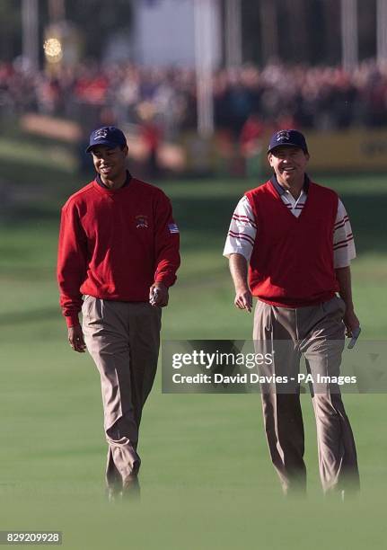 S Tiger Woods and Scott Hoch walk down the 1st fairway on the second day of practice for this weekend's Ryder Cup at the Belfry, near Sutton...