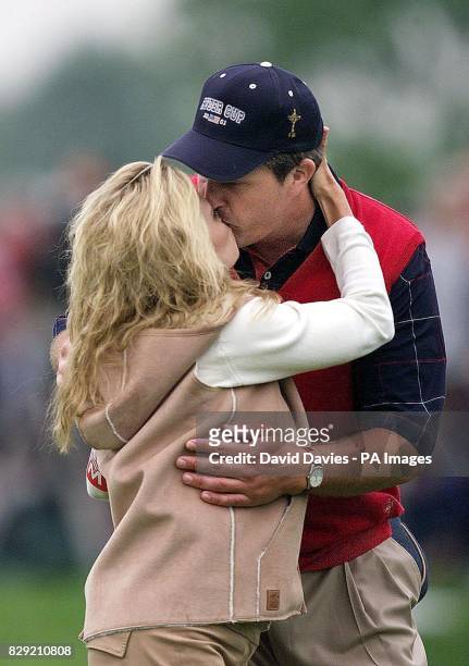 S Phil Mickelson kisses his wife Amy after this morning's foursomes in which he partnered David Toms. The pair played Europe's Pierre Fulke and...