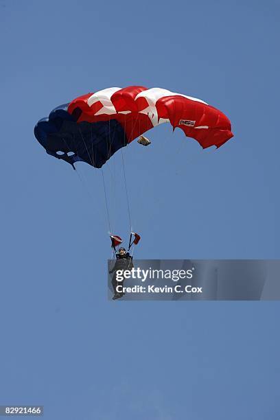 Skydiver parachutes onto the field before the Duke Blue Devils game against the Navy Midshipmen at Wallace Wade Stadium on September 13, 2008 in...