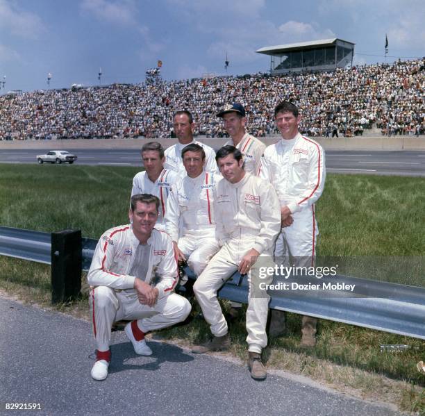 Driver Buddy Baker poses with the 1968 Dodge Boys, before the Carolina 500 race on June 16, 1968 at the North Carolina Speedway in Rockingham, North...