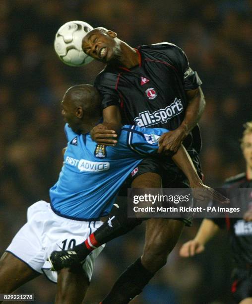 Manchester City's Shaun Goater battles with Charlton Athletic's Richard Rufus, during their FA Barclaycard Premiership match at Maine Road,...