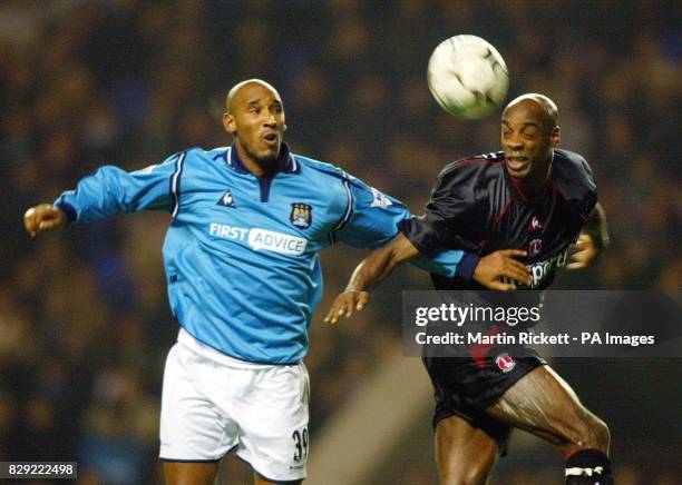 Manchester City's Nicolas Anelka is beaten to a header by Charlton Athletic's Richard Rufus during their FA Barclaycard Premiership match at Maine...