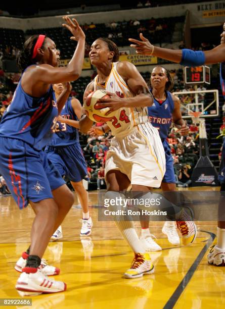 Tamika Catchings of the Indiana Fever takes on Kara Braxton of the Detroit Shock in Game One of the Eastern Conference Semifinals during the 2008...