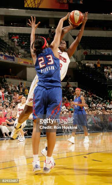 Ebony Hoffman of the Indiana Fever shoots over Plenette Pierson of the Detroit Shock in Game One of the Eastern Conference Semifinals during the 2008...