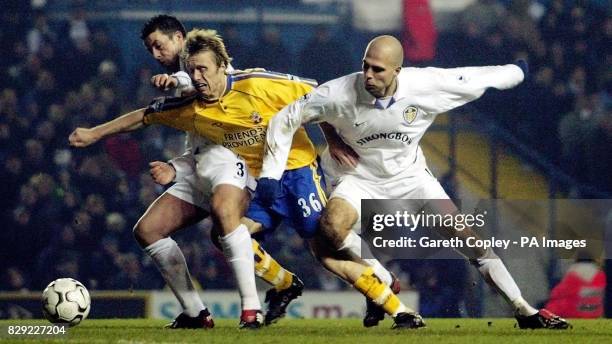 Leeds United's Ian Harte and Teddy Lucic tackle Southampton's Brett Ormerod during their FA Barclaycard Premiership match at Leeds' Elland Road...