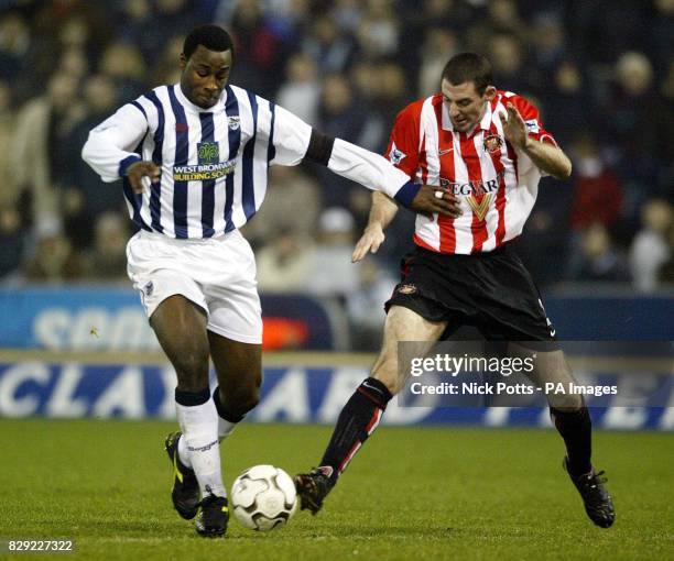 West Bromwich Albion striker Jason Roberts tussles with Sunderland's Stephen Wright for the ball during their FA Barclaycard Premiership match at...