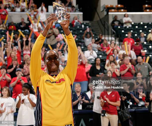 Ebony Hoffman of the Indiana Fever shows Fever fans the hardware she received after she was named the 2008 WNBA Most Improved Player prior to the...