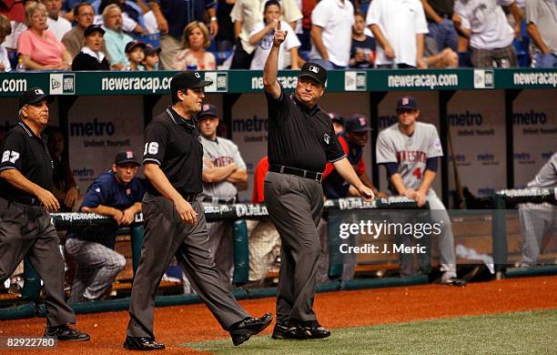 Umpire crew chief Gerry Davis calls for a home run after an instant replay review from Carlos Pena of the Tampa Bay Rays against the Minnesota Twins...