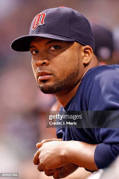 Pitcher Francisco Liriano of the Minnesota Twins watches his team from the dugout against the Tampa Bay Rays during the game on September 19, 2008 at...