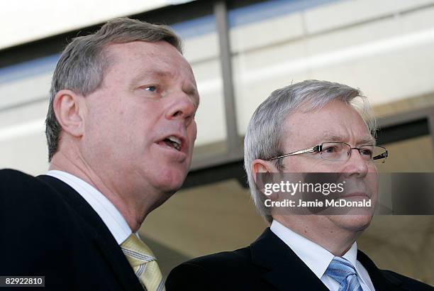 Prime Minister Kevin Rudd listens as South Australian Premier Mike Rann speaks to the press after Rudd delivered the opening keynote speech at the...