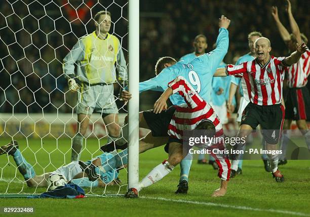 James Beattie and Chris Marsden of Southampton celebrate as Jo Tessem bundles his winning goal into the Sunderland net with the last touch of the...