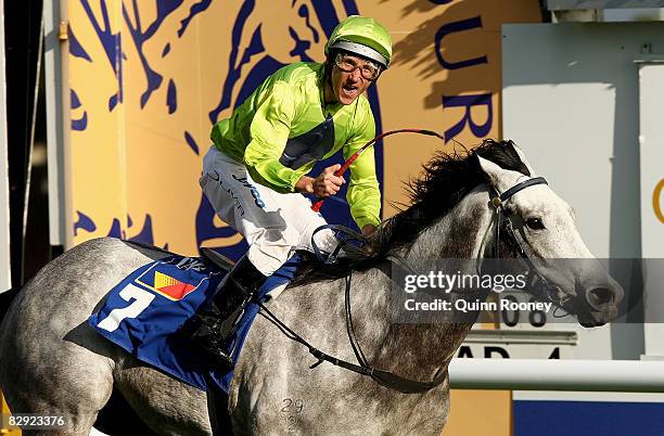 Jockey Damien Oliver, riding Orange County, celebrates winning the Sir Rupert Clarke Stakes during Underwood Stakes Day at Moonee Valley Racecourse...
