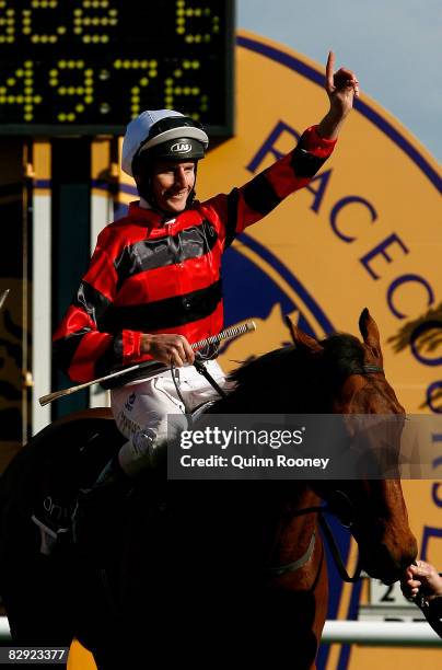 Jockey Brad Rawiller, riding Weekend Hussler, celebrates winning the Rock Ebony Underwood Stakes during Underwood Stakes Day at Moonee Valley...