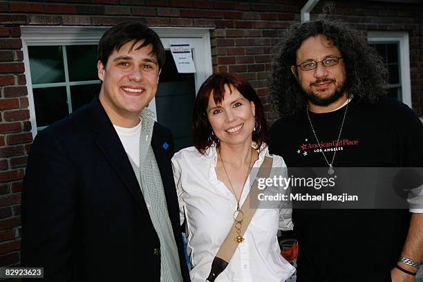 Professional poker player Annie Duke poses with and actors Rich Sommer and Joseph D Reitman at Debbie Durkin's Main Event Red Carpet Lounge and Green...