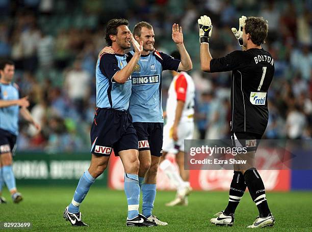 Tony Popovic, Clint Bolton and Iain Fyfe of Sydney FC celebrate after beating Adelaide United FC 3-0 in the round five A-League match between Sydney...