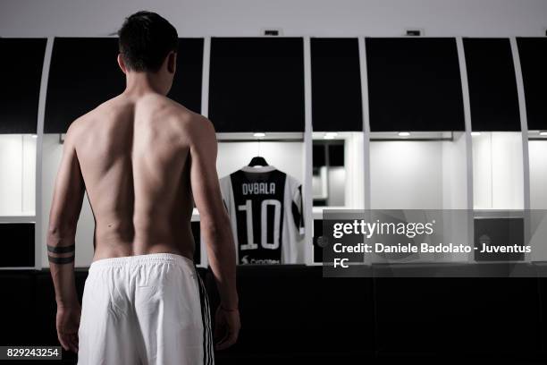 Paulo Dybala poses with his new Juventus shirt on August 10, 2017 in Turin, Italy.