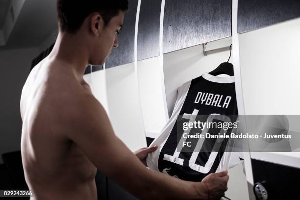 Paulo Dybala poses with his new Juventus shirt on August 10, 2017 in Turin, Italy.