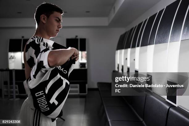 Paulo Dybala poses with his new Juventus shirt on August 10, 2017 in Turin, Italy.