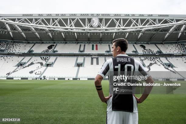 Paulo Dybala poses with his new Juventus shirt on August 10, 2017 in Turin, Italy.