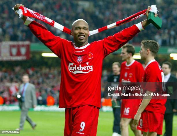 Liverpool's El-Hadji Diouf celebrates his team's 2-0 win over Manchester United in the Worthington Cup Final at the Millennium Stadium, Cardiff. THIS...