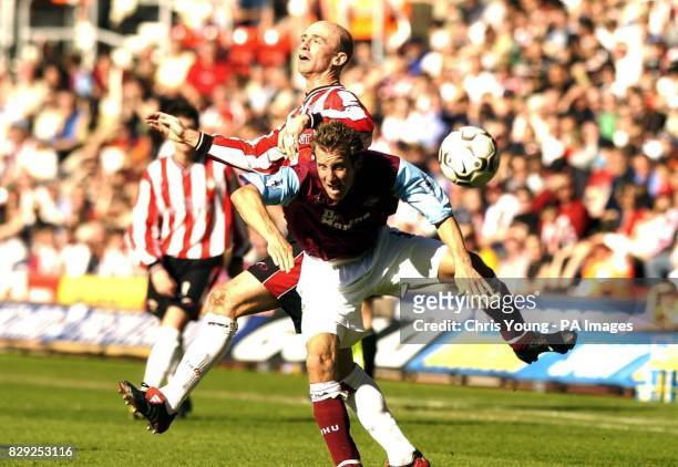 Southampton's Chris Marsden tangles with West Ham United's Lee Bowyer during their FA Barclaycard Premiership match at St. Mary's Stadium,...