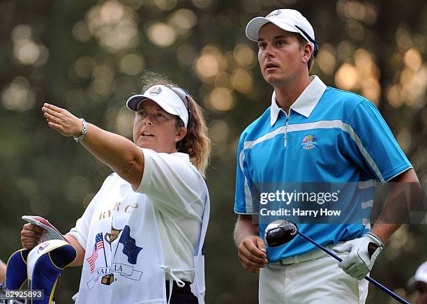 Robert Karlsson of the European team chats with his caddie Fanny Sunesson during the morning foursome matches on day two of the 2008 Ryder Cup at...