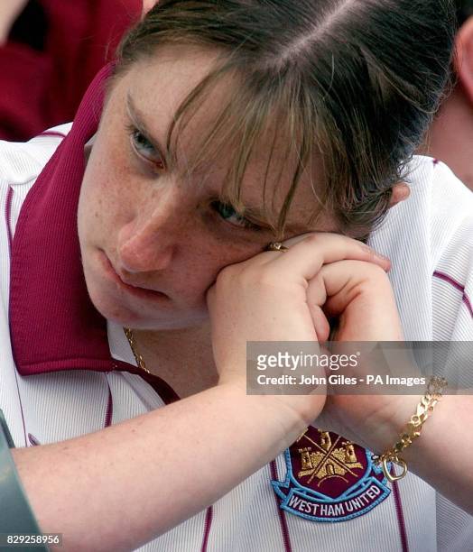 Dejection for a West Ham fan at the game against Birmingham as the news that Bolton had gone two goals up against Middlesbrough made the relegation...