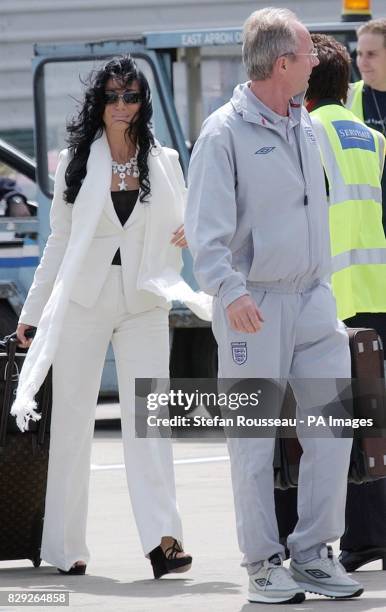 England coach Sven-Goran Eriksson and partner Nancy Dell'Ollio board their aircraft at Luton Airport for La Manga in Spain, where the England team...