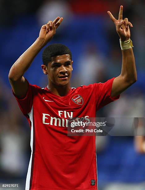 Denilson of Arsenal salutes his team's fans at the end of the Barclays Premier League match between Bolton Wanderers and Arsenal at the Reebok...