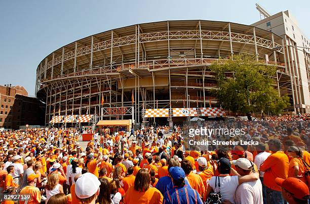 Fans watch on as the Tennessee Volunteers make their way through the crowd during the Vol Walk before the start of their game against the Florida...
