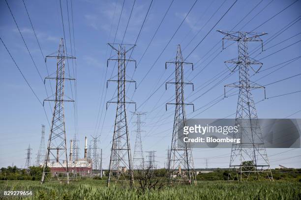 Power lines stand near the NRG Energy Inc. Joliet Generating Station in Joliet, Illinois, U.S., on Wednesday, July 26, 2017. Coal-fired power plants...
