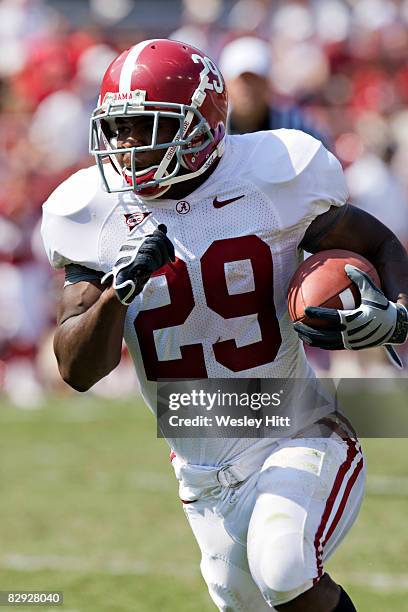 Terry Grant of the Alabama Crimson Tide runs with the ball against the Arkansas Razorbacks at Donald W. Reynolds Stadium on September 20, 2008 in...