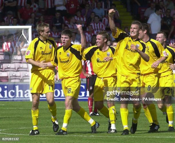 Rushden and Diamonds' Kevin Braniff is congratulated on opening the scoring by team-mates Andy Burgess, Gary Mills, Philip Gulliver, Stuart Gray and...