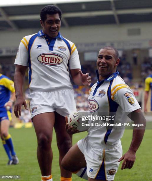 Leeds Rhinos' Chev Walker celebrates his first try against Warrington Wolves with team mate Ali Lauitiitiat during their Tetley's Super League match...