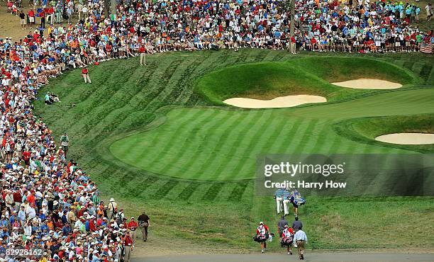 Players and caddie approach the 14th green during the afternoon four-ball matches on day two of the 2008 Ryder Cup at Valhalla Golf Club on September...