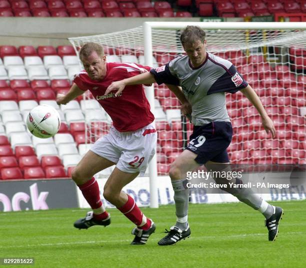 Nottingham Forest's Jon Olav Hjelde battles with Crewe double goal scorer Mark Rivers during their Coca-Cola Championship match at the City Ground,...