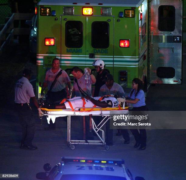 Linebacker Brouce Mompremier of the University of South Florida is transported to a helicoptor after an un-disclosed injury while playing against...