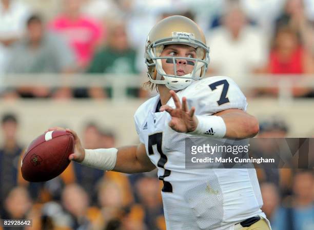 Jimmy Clausen of the Notre Dame Fighting Irish throws a pass against the Michigan State Spartans on September 20, 2008 at Spartan Stadium in East...