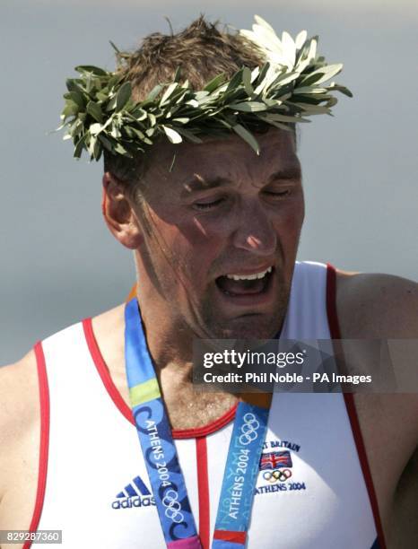 British four time Olympic Gold Medallist rower Matthew Pinsent reacts after his team won the Men's Four final during the 2004 Olympic Games at the...