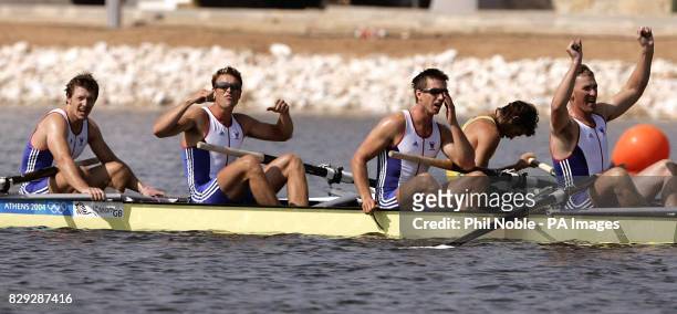 Great Britain's Olympic Gold Medal winning Men's Four rowing team Steve Williams, Ed Coode, James Cracknell and Matthew Pinsent react after winning...